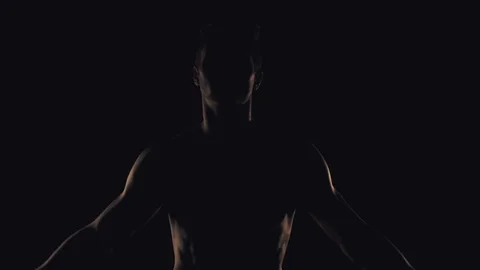 Silhouette of man on black background Stock Footage 99810571