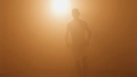 Silhouette of man breakdancing and doing flip with one hand Video stock 132070641