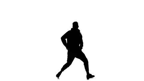 Silhouette of man dancer dancing hip hop, freestyle, street dance, slow motion Stock Footage 130334427