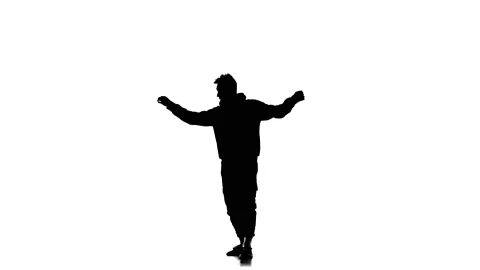 Silhouette of man dancer dancing hip hop, freestyle, street dance, slow motion Stock Footage 130334604