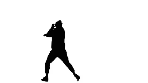 Silhouette of man dancer dancing hip hop, freestyle, street dance, slow motion Stock Footage 130334731