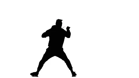 Silhouette of man dancer dancing hip hop, freestyle, street dance, slow motion Stock Footage 130334893