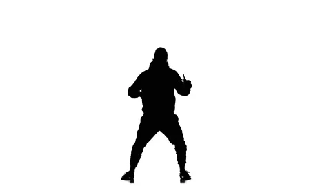 Silhouette of man dancer dancing hip hop, freestyle, street dance, slow motion Stock Footage 130334906