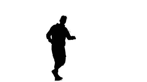 Silhouette of man dancer dancing hip hop, freestyle, street dance, slow motion Stock Footage 130335005