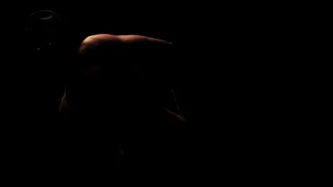 Silhouette of a man dancing in the dark Stock-Footage 92540753