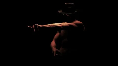 Silhouette of a man dancing in the dark Video stock 92540897