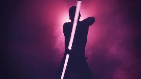 Silhouette of man dancing with lamp in smoke Video stock 80598046
