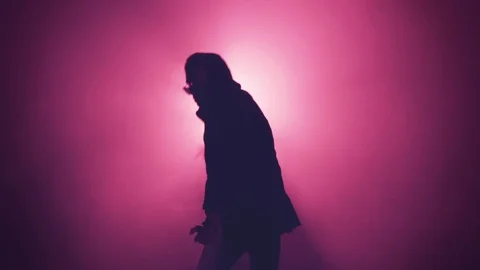 Silhouette of man dancing in smoke Stock Footage 80597921