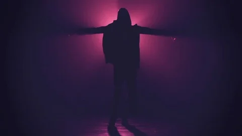 Silhouette of man dancing in smoke Stock-Footage 80597930