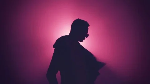 Silhouette of man dancing in smoke Stock Footage 80598014