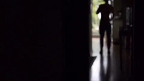 Silhouette of man in dark room dancing with headphones in slow motion , Portugal Stock Footage 129066564