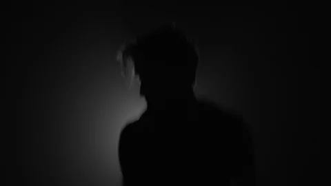 Silhouette of man doing warm up jumps before workout Stock Footage 104065714