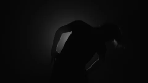 Silhouette of man doing warmup stretching before workout Stock Footage 104065487