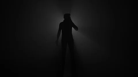 Silhouette of man drinking beer from can and smoking cigarette Video stock 104051546