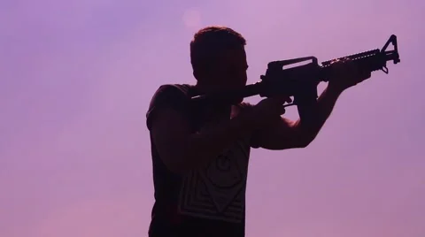 Silhouette man enter shot with M4 動画素材 48897658
