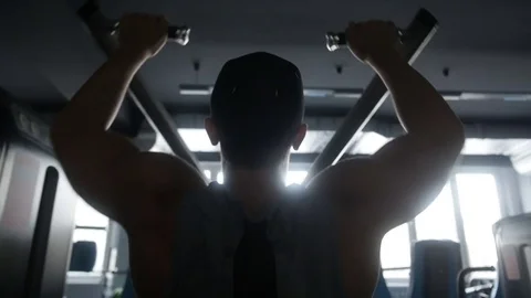 Silhouette of a man exercise on his shoulders Video stock 83036625