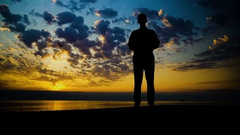 Silhouette of Man Exercising at Sunset Stock Footage 115125441