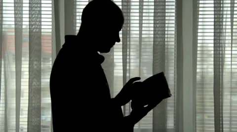 Silhouette of man in front of window Vídeo Stock 32759572