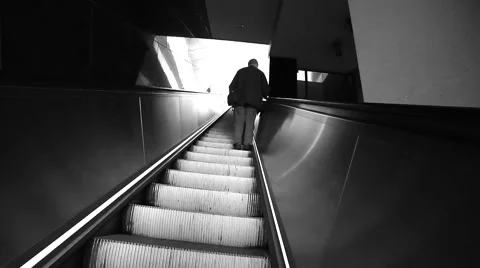 Silhouette of man going up on escalator Stock Footage 54648863