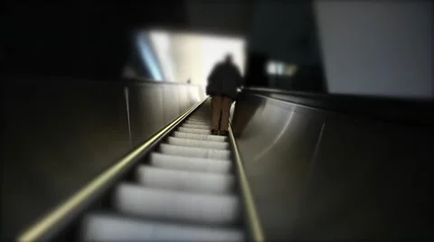 Silhouette of man going up on escalator Stock Footage 54648993
