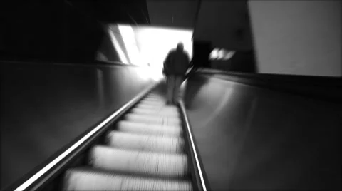 Silhouette of man going up on escalator Stock Footage 54654336