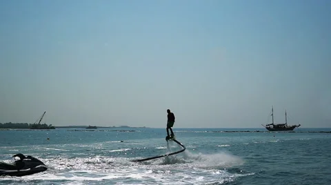 Silhouette of a Man Having Fun on Flyboard in the Sea. Stock Footage 68023365