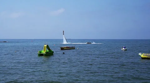 Silhouette of a Man Having Fun on Flyboard in the Sea. Stock Footage 68023453