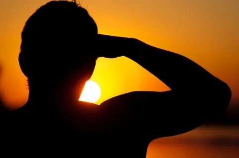 Silhouette of man looking into the distance Stock Photos