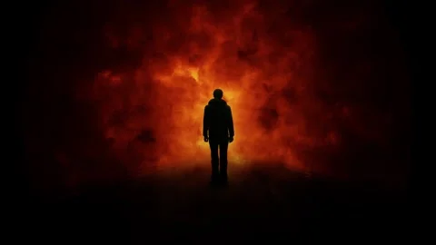 Silhouette of a man with loop fire flames animation Stock Footage 337535990
