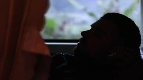 Silhouette of man lying in bus. Stock Footage 305370758