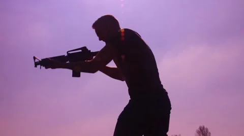 Silhouette man with m4 aim and spin 2 動画素材 48897572