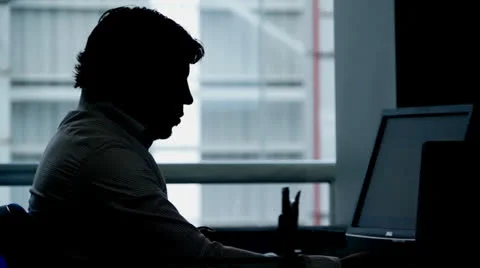 Silhouette of a man at the office Stockbeeldmateriaal 27194276