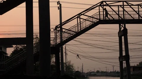 Silhouette of man or engineer  is wearing constructor helmet walk down the stair Stock Footage 128166049