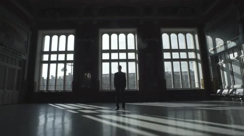 Silhouette Of Man Over Big Windows Vídeo Stock 64413609