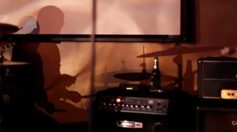 Silhouette of a man playing drums  Stock Footage 7899691