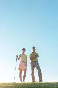 Silhouette of a man pointing while standing next to his partner Stock Photos