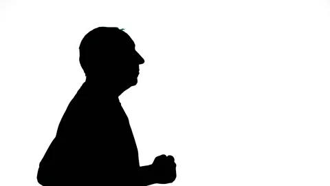 Silhouette of a man in profile on a white background running Stock Footage 155356351