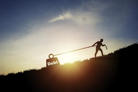 Silhouette of man pulling debt weight box for debt and financial freedom co.. Stock Photos