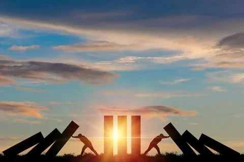 Silhouette man pushing rectangle  block which falling to stop dominos others Stock Photos