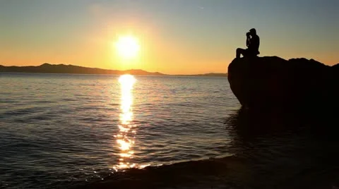 Silhouette of man recording video Stock Footage 24669592