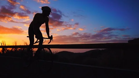 Silhouette of a man riding a Bicycle at Stock Video Pond5