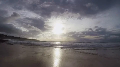 Silhouette of a man running into the ocean at sunset in slow motion Stock Footage 88663743