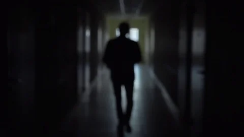 Silhouette of a man runs through the dark corridor. Stock Footage 75802978