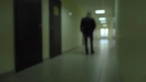 Silhouette of a man runs through the dark corridor. Stock Footage 76185698