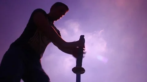 Silhouette man with samurai sword low angle stab Stock Footage 48897218