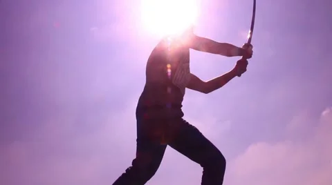 Silhouette man with samurai sword spin and stab 2 Stock Footage 48897353
