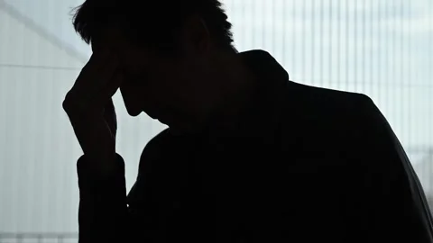 Silhouette of a man with severe headache, 4K Stock-Footage 326766775