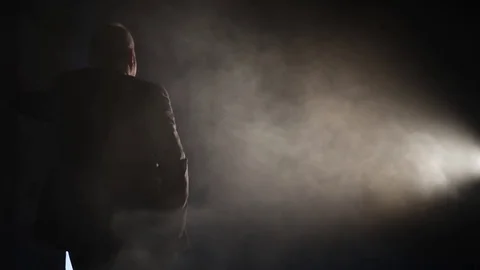 Silhouette of a man in the smoke  backlight 2 Stock Footage 71185800