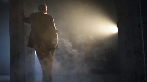Silhouette of a man in the smoke  backlight Stock Footage 71185775