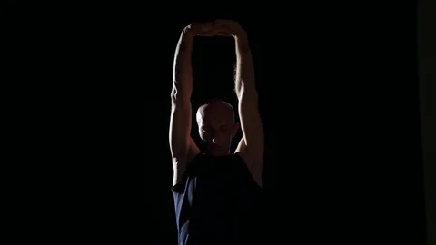 Silhouette of man stretching Stock Footage 82660035
